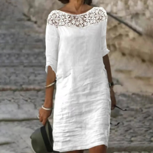 Robe en dentelle blanche mi-longue avec manches courtes idéale